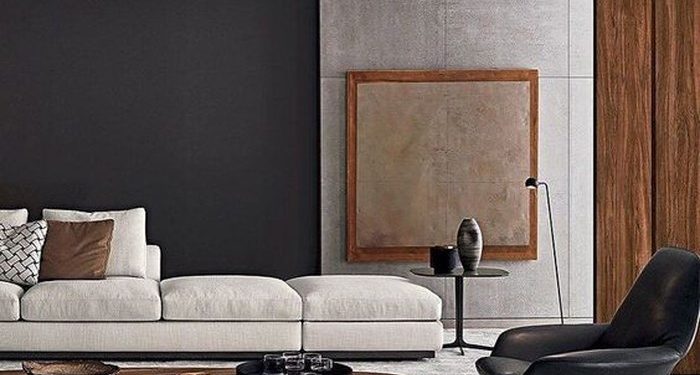 Chiếc bàn uống nước thấp cùng ghế tròn màu nâu đậm được kết hợp với chiếc ghế da hiện đại